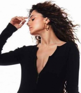 Elevate your style: Taapsee Pannu dazzles in a backless bodysuit, thigh-high boots, and bold hoops