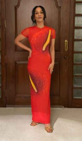 Masaba Gupta looks ethereal in a hot orange figure-hugging anthurium semi-sheer ankle-length dress from Loewe