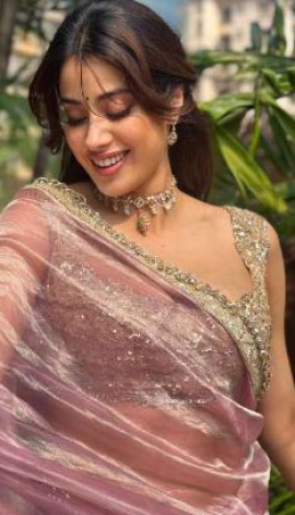 Janhvi Kapoor flaunts her love for Manish Malhotra in a classy pink and gold handwoven tissue saree