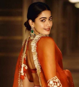 Rashmika Mandanna gives us a taste of festive glam in orange organza lehenga with gold embroidery
